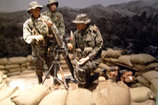Training local government troops in mortar fire.
