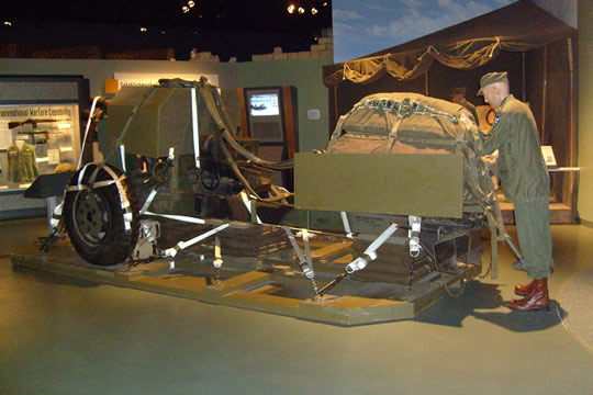 Artillery Piece on a pallet being prepared to be dropped from a plane.
