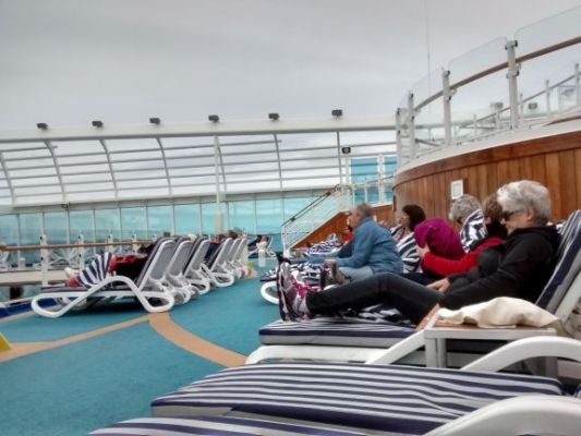 Watching movies and trying to stay warm by the pool
