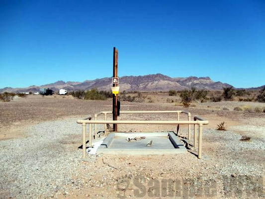 Some BLM areas provide a dump station
If you don't want to move either use a Blueboy to empty or hire honey wagon service. Currently $25 per pumpout.
