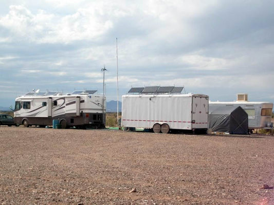 Having it all
The trailer is full of batteries and controller. The roof is loaded with solar panels. He has 17 solar panels in all. Also has a wind turbine. He wants for nothing. Has a  stand-alone freezer and 42 inch TV.
