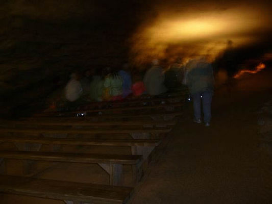 Brief stop for a rest and questions
Mammoth Cave is a dry cave. Being dry allowed it to grow to over 500 miles long. Dry caves look very different from wet caves. There are very few stalagtites and stalagmites. This cave is still growing too. A thick sandstone cap is what keeps it dry. If you have allergies, you won't notice them in here. For a few months quite some time ago, a doctor had huts built of stone in the caverns and used them for patients with tuberculosis (consumption). Unfortunately, it did not help and was abandoned. 
