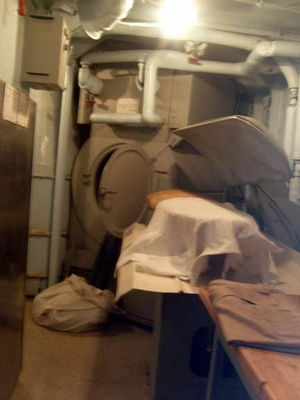 Laundry
No irons here. They use a press. Bet that gets hot in this tiny space.
