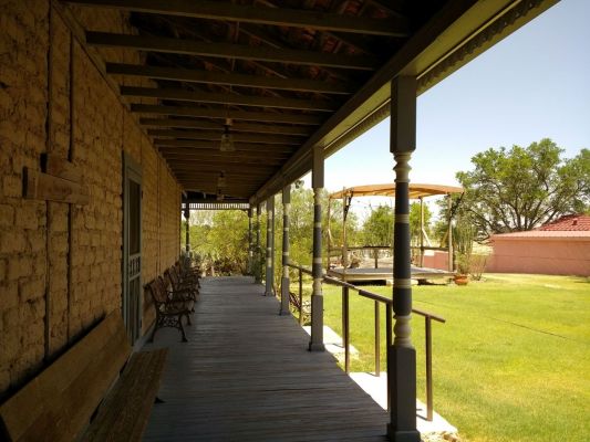 Nice veranda all around hotel to help cool rooms made of thick stone walls.
