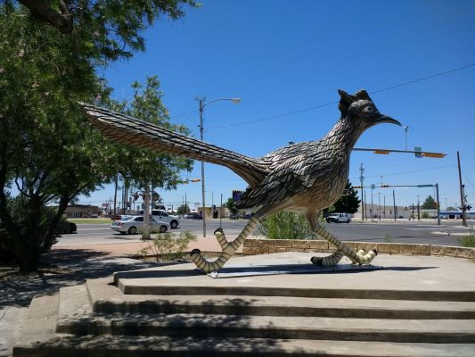 Giant roadrunner sculpture and nearby geocache.
