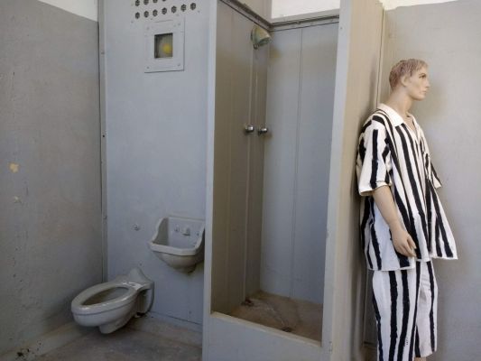 Private shower and toilet in isolation cell.
