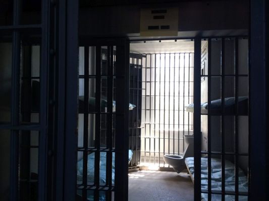 Cell in the big cage.
They later built one big cage in a large room then built smaller cells inside that to house men, women, and juveniles together in one area but in separate though highly visible cells.
