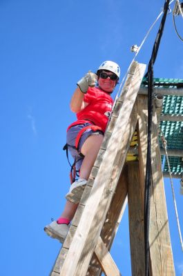 Me climbing the rope course tower

