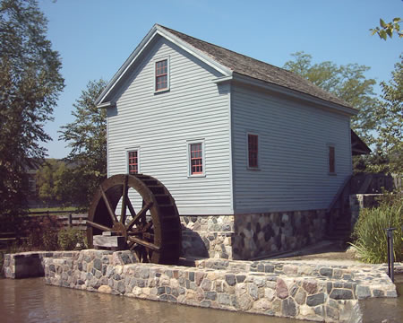 Mill with working water wheel. The grindstones are there but disconnected.
