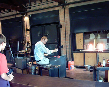 Learn to make a glass flower here. He's making a vase.
