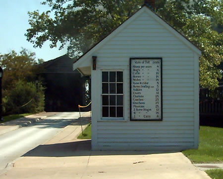 Tollbooth
As much as we hate toll roads, they have been around a long time. This one charges a toll to use the covered bridge behind it. Look close. The tolls are in cents!
