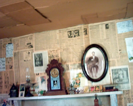 Inside The Mattox House
Cardboard ceilings and newspaper walls kept the cold out. Standing in the corner would be much more interesting punishment as a kid with newspaper covered walls.
