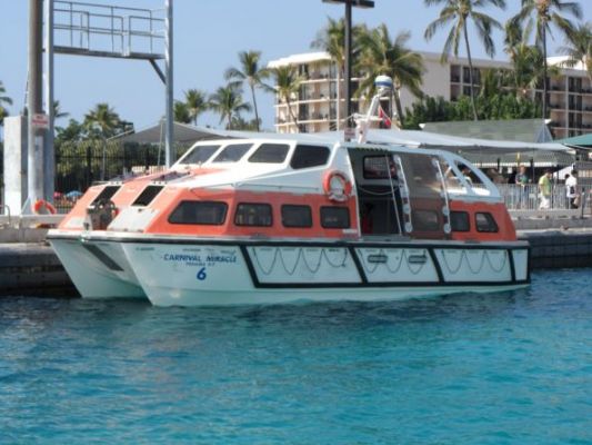 Carnival Miracle lifeboat used as a tender to get us ashore in Kona, HI
Couldn't dock in Kona due to depth so they tendered us ashore. This was the last time they will visit this port because they are changing ships and new ship can't anchor here.
