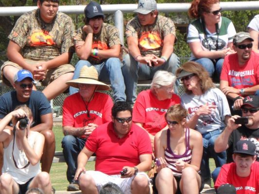 Grandma and grandpa of annual family visit to the festival
Their entire family don matching T-shirts made special each year for them and attend the hog festival. This year was red. 
