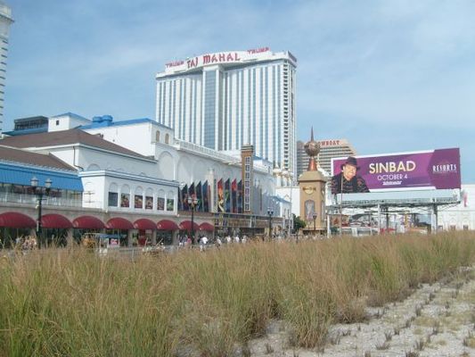 Hotels, shops, dining, and casinos line the boardwalk along the beach
