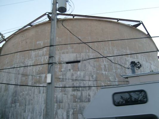 Water cistern
Before water was piped in by the Navy, the Keys depended on rain water saved in cisterns for their water needs. During the 1800s a great fire swept through the area. Residents watched from boats as fire hopped from roof to roof destroying their homes. Since then, only metal roofs, which had survived the fire, were allowed on homes. This also helped with gathering rain water in gutters into cisterns.

