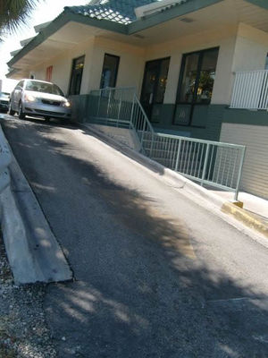 Very steep McDonald's drive thru
It is steeper than it looks. Pulling out, you can't see the driveway so it is very much like a roller coaster ride and fun with a sharp turn to the right at the bottom.
