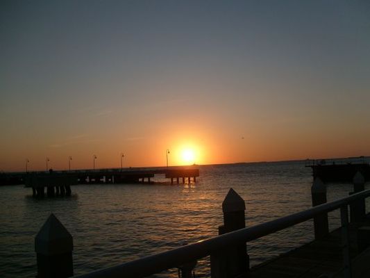 Watching the setting sun
The most popular activity in the Keys is watching the sun set into the water. Every evening people gather at the beaches and piers to watch the grand performance. It reminds me of the scene of the angels on the beach listening to music only they can hear in the movie "City of Angels" wth Meg Ryan and Nicholas Cage.
