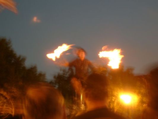 Riding a unicycle while playing with fire. Bring lots of dollar bills with you to the festival to tip the street performers. They are pretty aggressive about it since they don't get paid by the city to perform.
