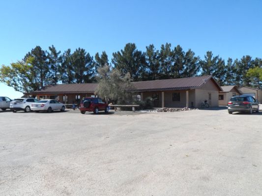 Clubhouse with covered veranda and lots of rocking chairs
Behind it is the wood shop and welding shop.
