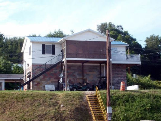 Smart guy
He bought a decrepit car wash with land. Built or fixed the house on top of the autowash like a treehouse. The enclosed porch has chairs and a ceiling fan for breeze. Later he added the campground. Then he added storage rentals.
