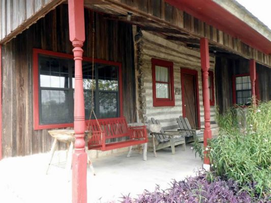 Great porch with swing and Adirondack chairs
