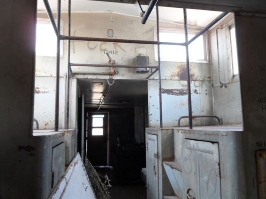 Inside the caboose lookng for the geocache

