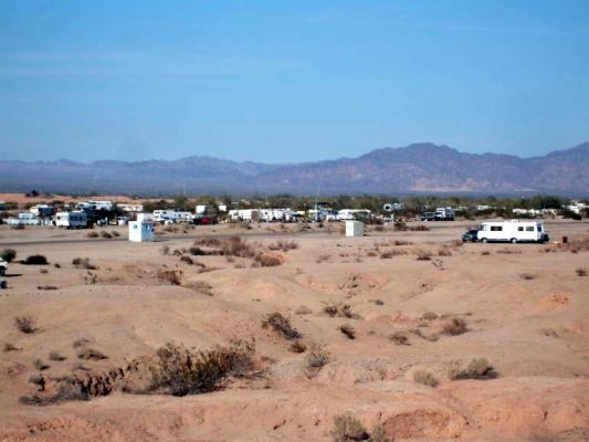 Slab City, CA aka The Slabs
Formerly a military base, now home to snowbirds and those with nowhere else to go. 
