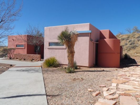 Village created near the Biosphere for scientists
Uses green materials and big barrels on the right are cisterns to recycle rain water.
