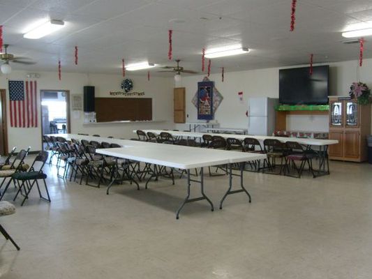 Dining room and big screen TV
They have movie nights with popcorn and we watched the ball drop in NYC on it during our New Year's Eve party. The dining room is also a great place to cut fabric or do other large projects outside the small space of an RV.
