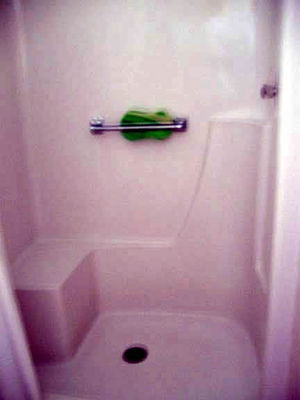 Only 2 showers in the bathrooms which seems to be enough since everyone is self-contained.
The showers are great and definitely some thought was put into them for older people. The sponge is for wiping down the shower yourself when done.
