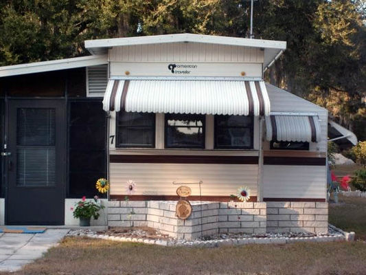Full-time resident
The full-timers add the heavy outside shades, extra rooms, and roof caps like this one. Trailers with hats!
