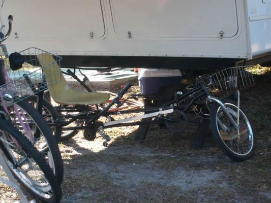 The bike in the back is one used by those of us who need more support when riding. It is low to the ground and easy to sit in with legs out in front.

